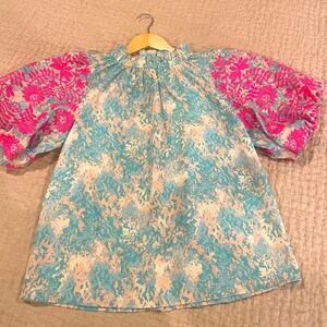 THML top with pouf sleeves, wooden buttons down back. Medium.